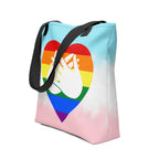 An angled view of a white Tote bag with a black handle and a pride heart with the BSL love sign at its centre.