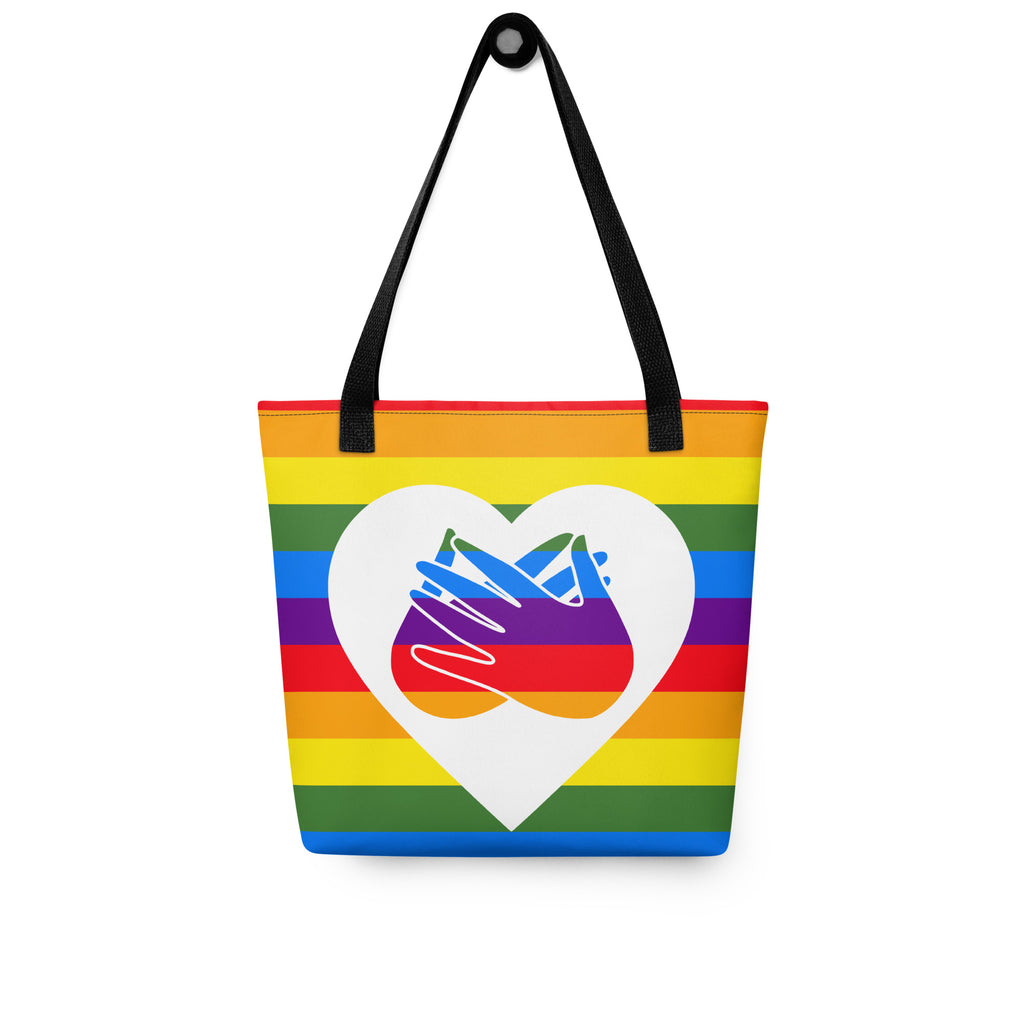 Pride rainbow coloured tote bag with a black handle and a white heart with the BSL love sign at its centre.