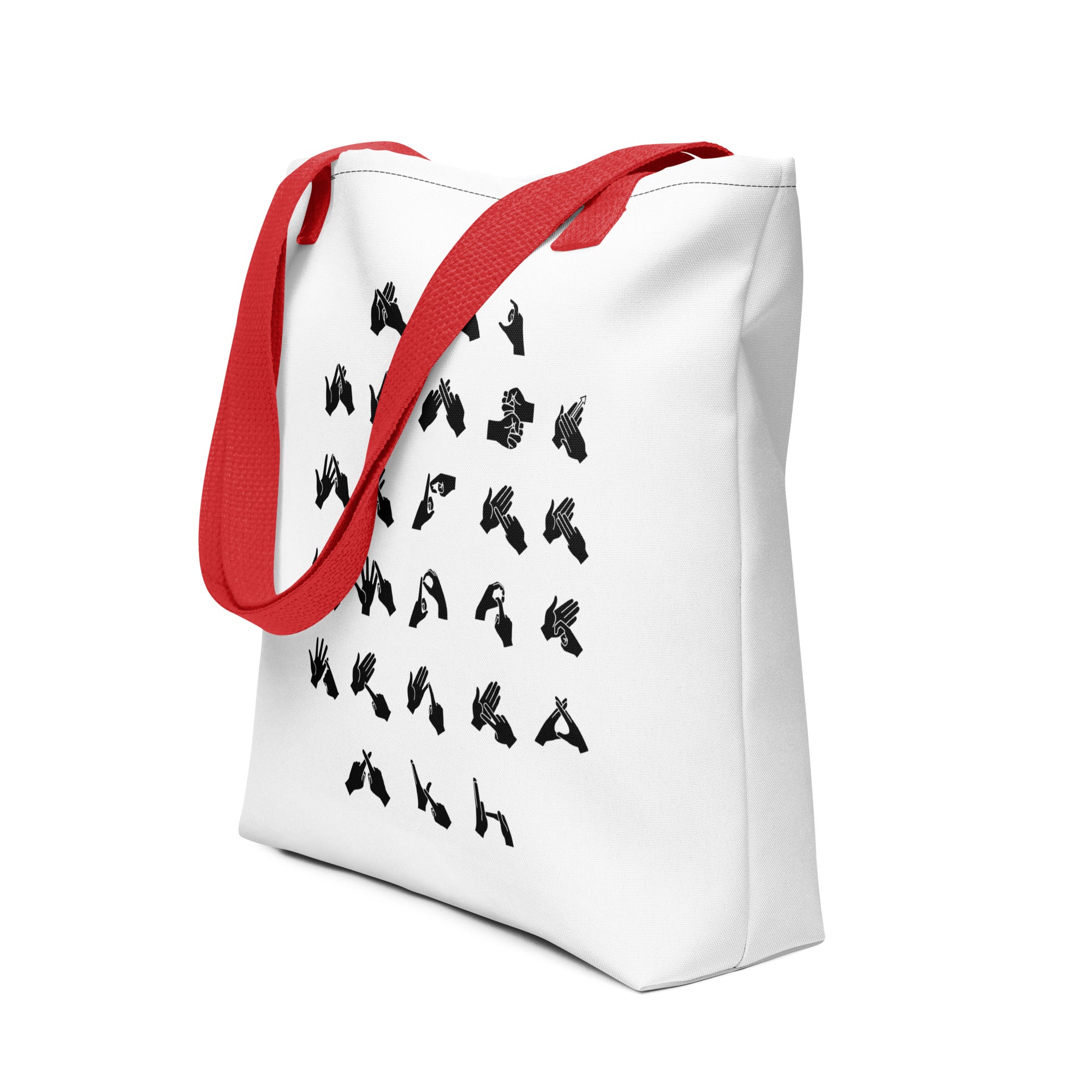 An angled view of a white Tote Bag with a red handle showing BSL Alphabet - Black Fingerspelling
