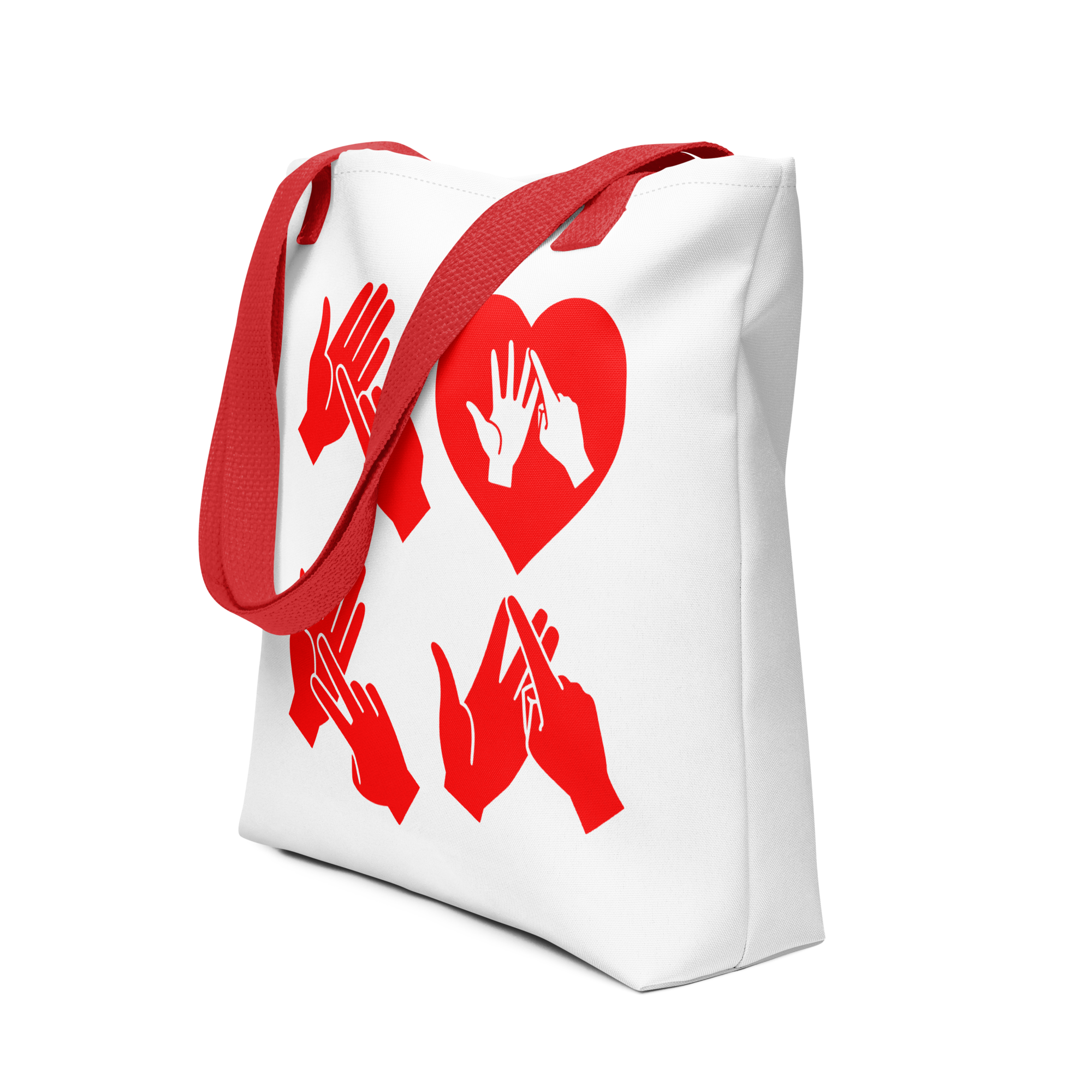 An angled view of a white Tote Bag with red handle showing the word Love in red BSL Fingerspelling with the 'O' embedded in a heart shape