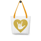 Tote bag with a yellow handle and a gold heart with the ASL I love you sign at its center.