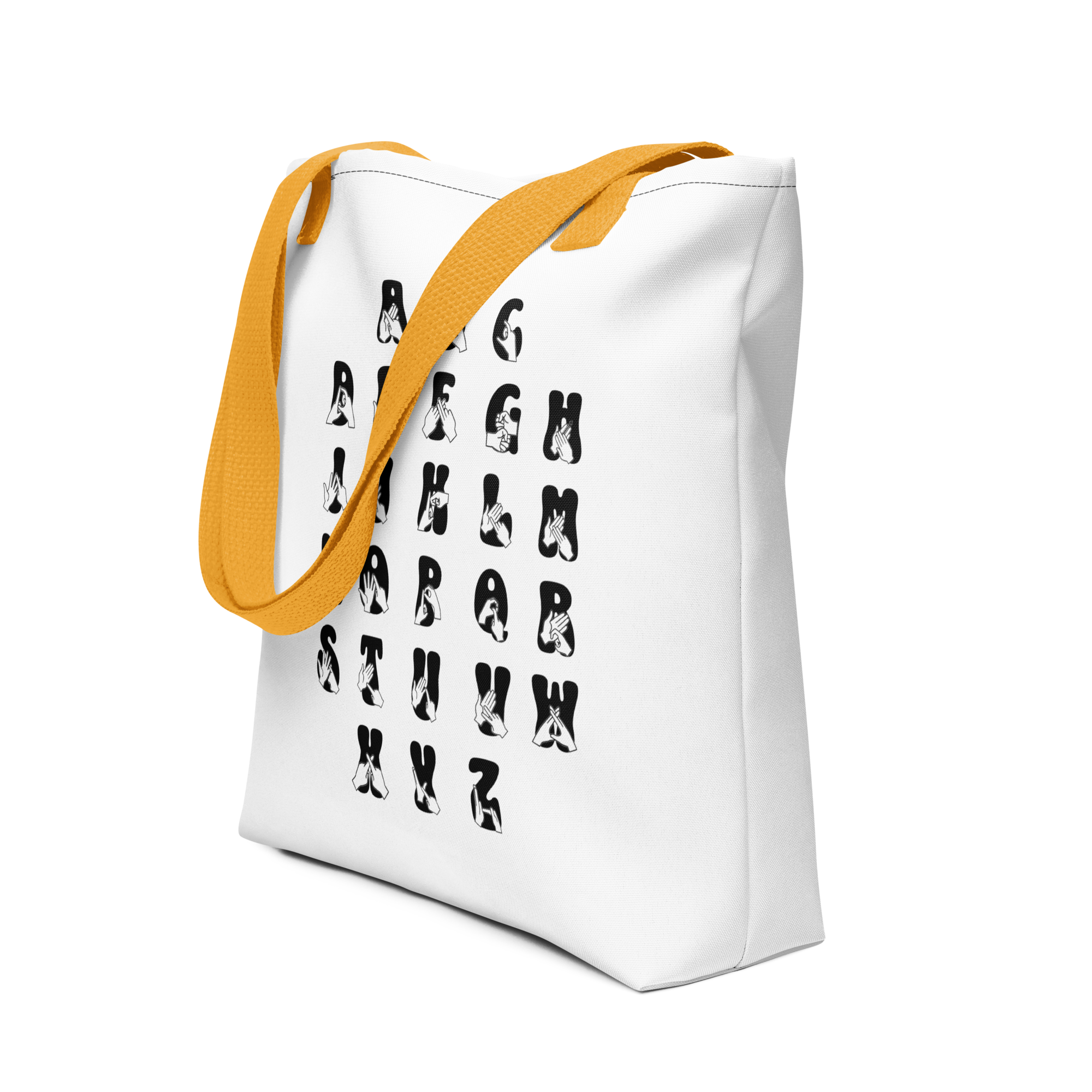 Angled view of White Tote Bag with a yellow handle showing BSL Alphabet - Black Fingerspelling & Text