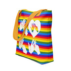 An angled view of a pride rainbow coloured tote bag with a yellow handle and the word LOVE in white BSL fingerspelling design