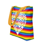 An angled view of a pride rainbow coloured tote bag with a yellow handle and a white ASL mosaic heart design