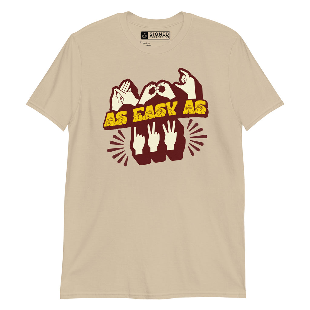 Front view of a sand t-shirt with the phrase ABC As Easy As 123 in Fingerspelling & Text
