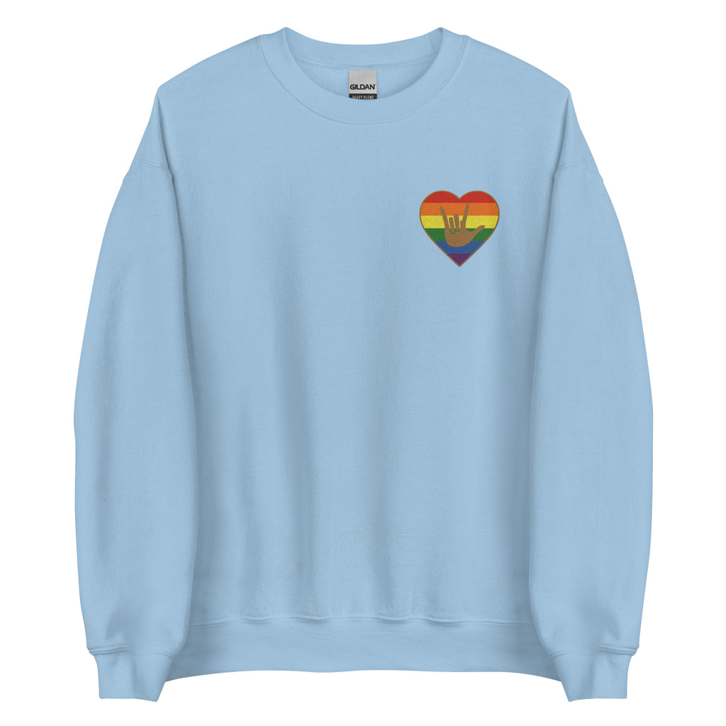 Front view of a light blue sweatshirt showing a pride coloured heart and the iconic ASL I Love You sign embedded in it on the left side of the chest