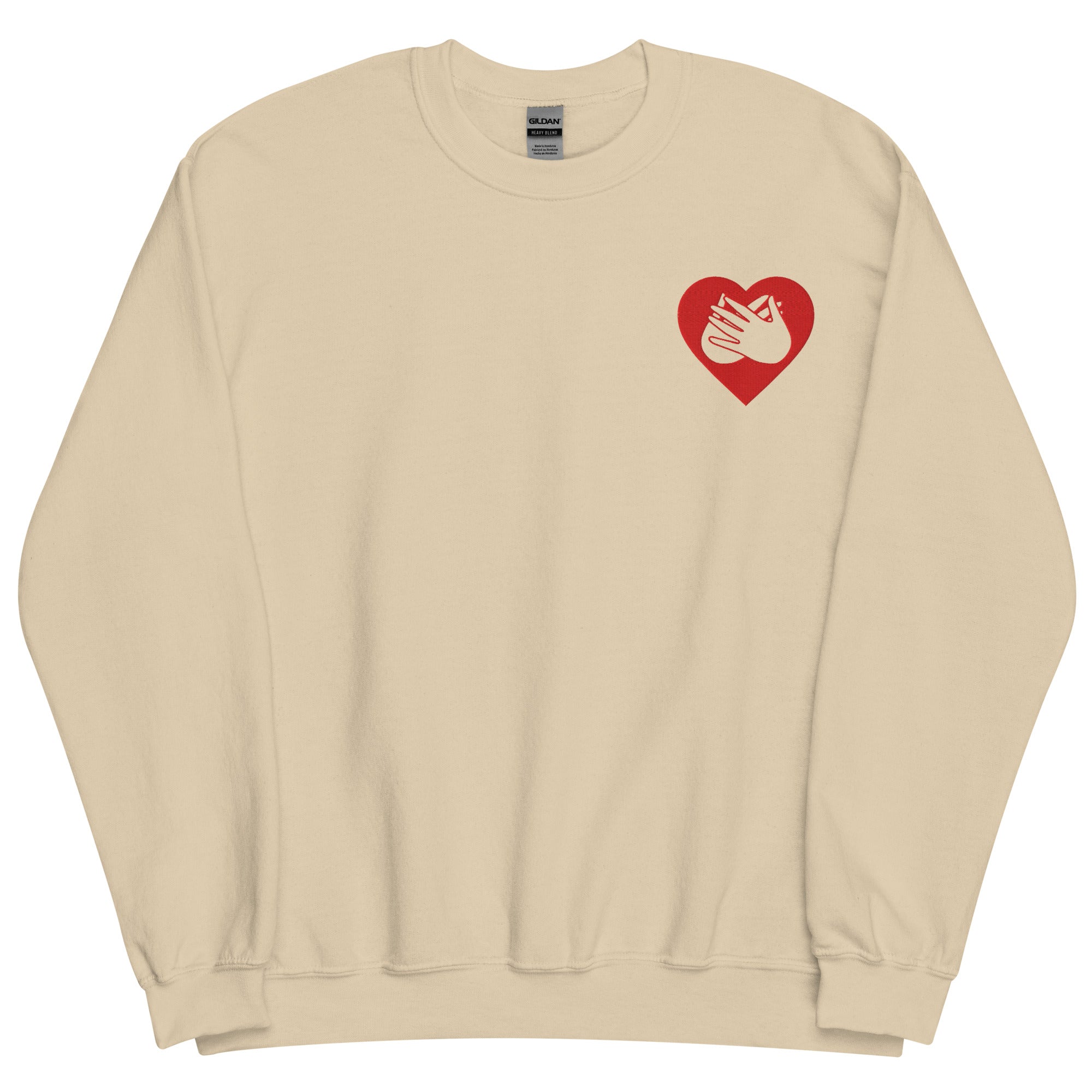 Front view of a sand sweatshirt showing a red coloured heart and the iconic BSL Love sign embedded in it on the left side of the chest