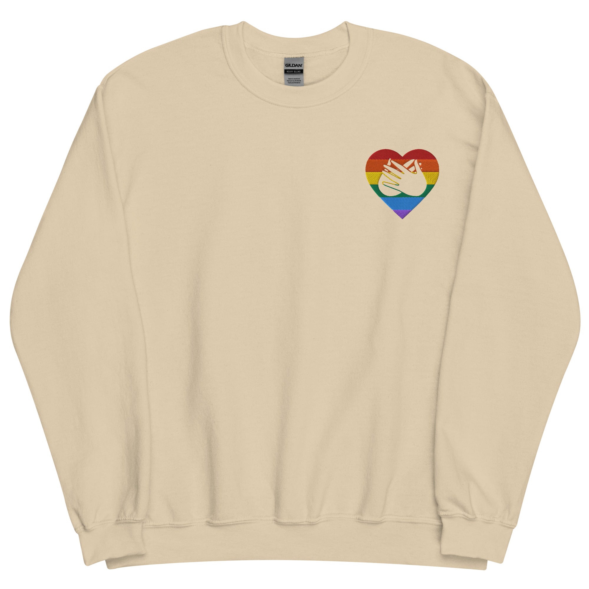 Front view of a sand sweatshirt showing a pride coloured heart and the iconic BSL Love sign embedded in it on the left side of the chest