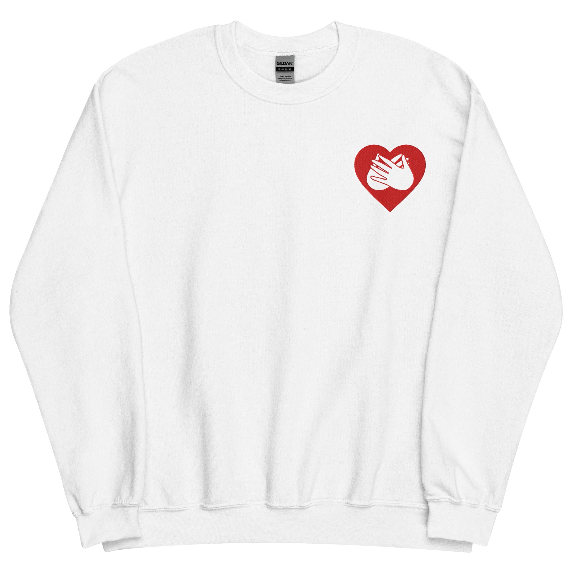 Front view of a white sweatshirt showing a red coloured heart and the iconic BSL Love sign embedded in it on the left side of the chest