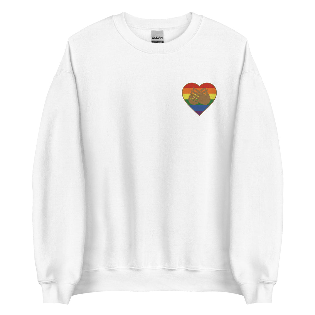 Front view of a white sweatshirt showing a pride coloured heart and the iconic BSL Love sign embedded in it on the left side of the chest