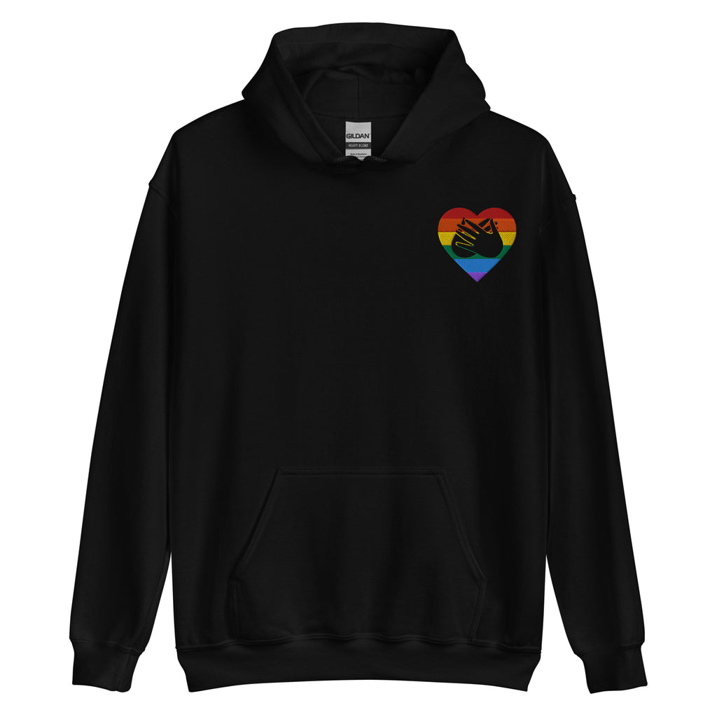 Front view of a black hoodie showing a pride coloured heart and the iconic BSL Love sign embedded in it on the left side of the chest