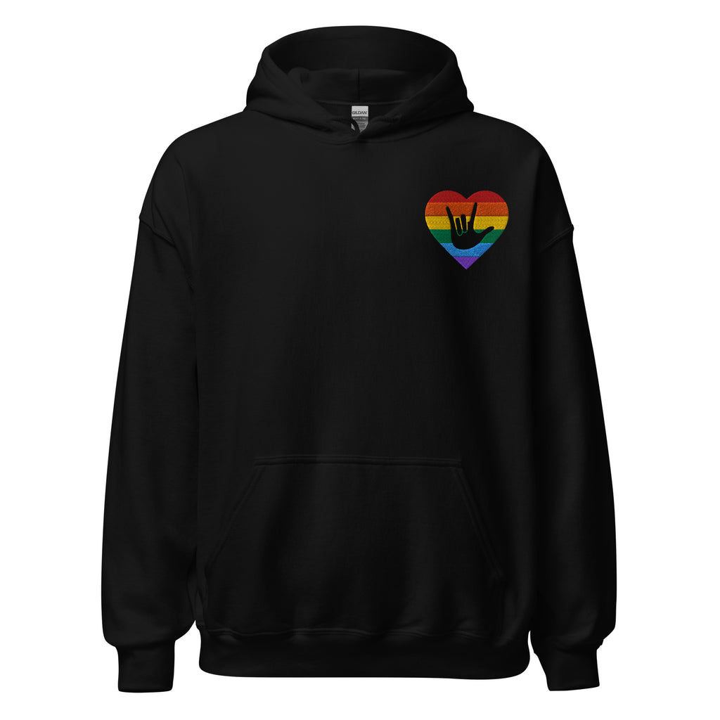Front view of a black hoodie showing a pride coloured heart and the iconic ASL I Love You sign embedded in it on the left side of the chest
