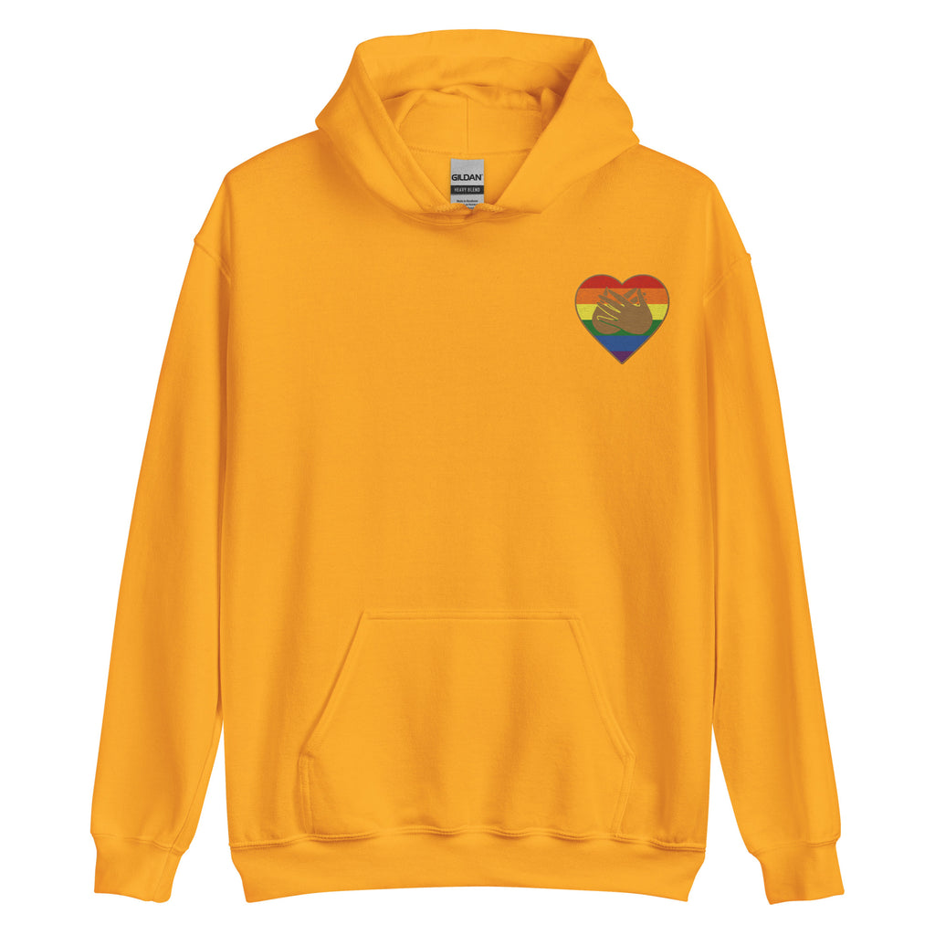 Front view of a gold hoodie showing a pride coloured heart and the iconic BSL Love sign embedded in it on the left side of the chest