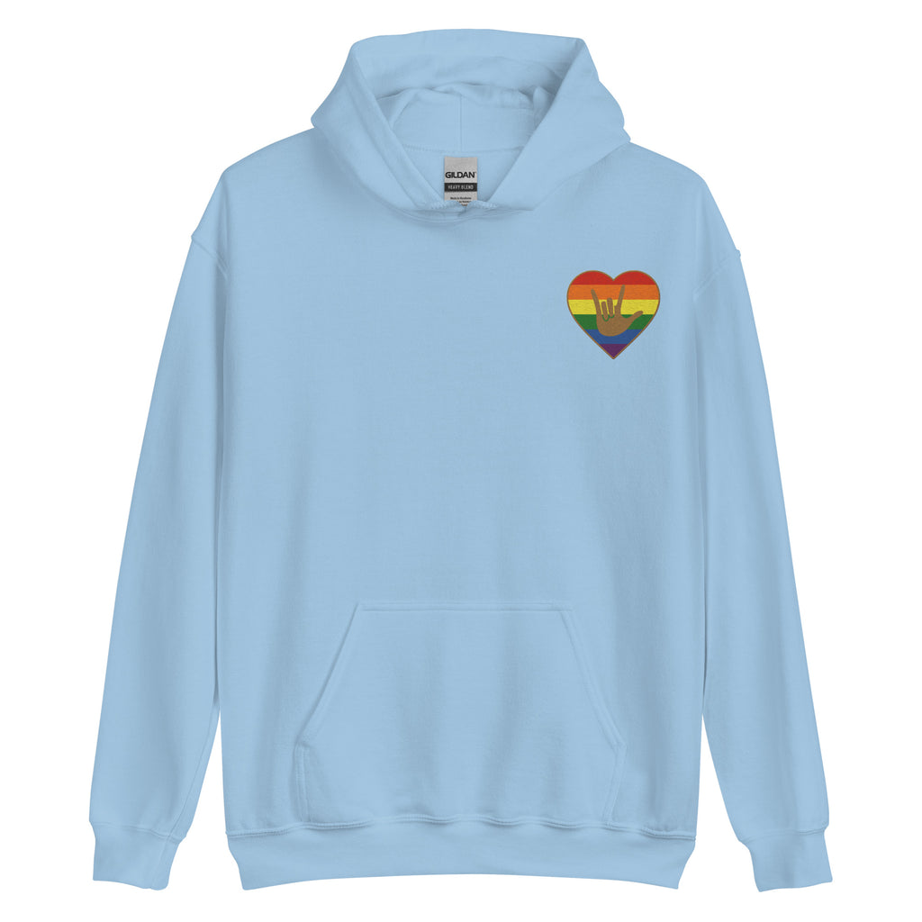 Front view of a light blue hoodie showing a pride colored heart and the iconic ASL I Love You sign embedded in it on the left side of the chest