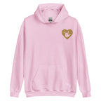Front view of a light pink hoodie showing a gold coloured heart and the iconic ASL I Love You sign embedded in it on the left side of the chest