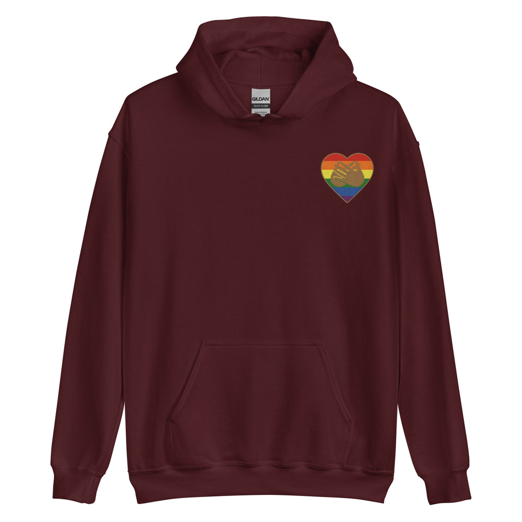 Front view of a maroon hoodie showing a pride coloured heart and the iconic BSL Love sign embedded in it on the left side of the chest