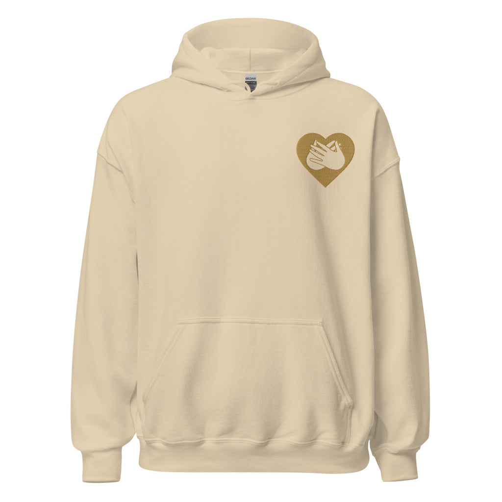 Front view of a sand hoodie showing a gold coloured heart and the iconic BSL Love sign embedded in it on the left side of the chest
