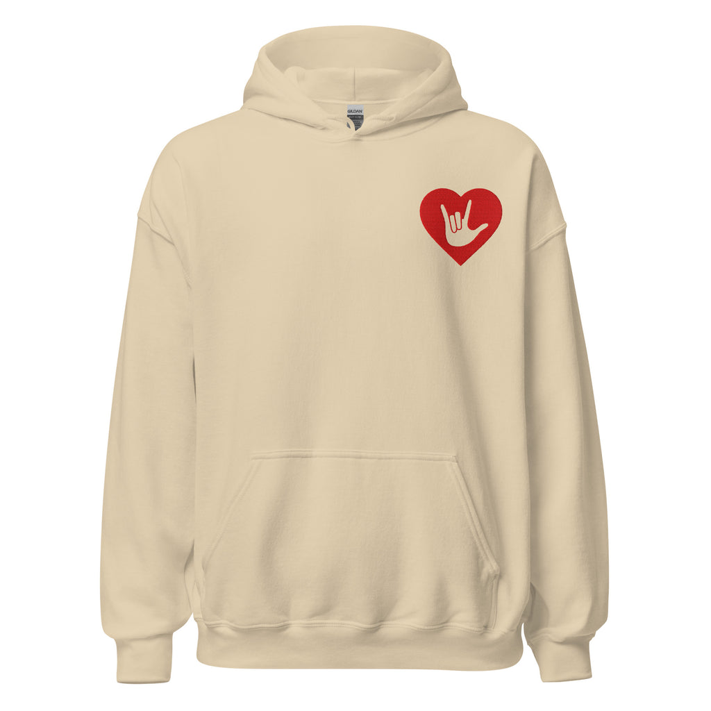 Front view of a sand hoodie showing a red coloured heart and the iconic ASL I Love You sign embedded in it on the left side of the chest