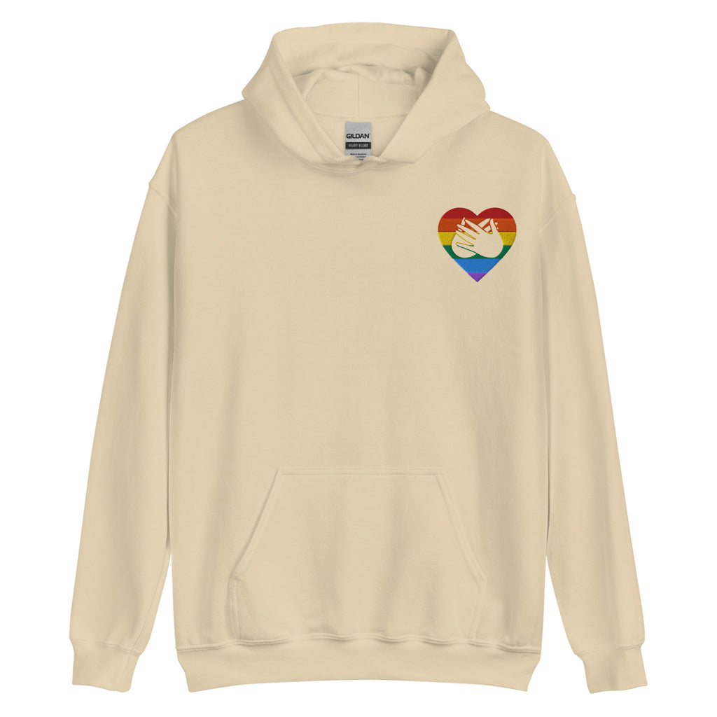 Front view of a sand hoodie showing a pride coloured heart and the iconic BSL Love sign embedded in it on the left side of the chest