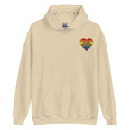 Front view of a sand hoodie showing a pride coloured heart and the iconic BSL Love sign embedded in it on the left side of the chest