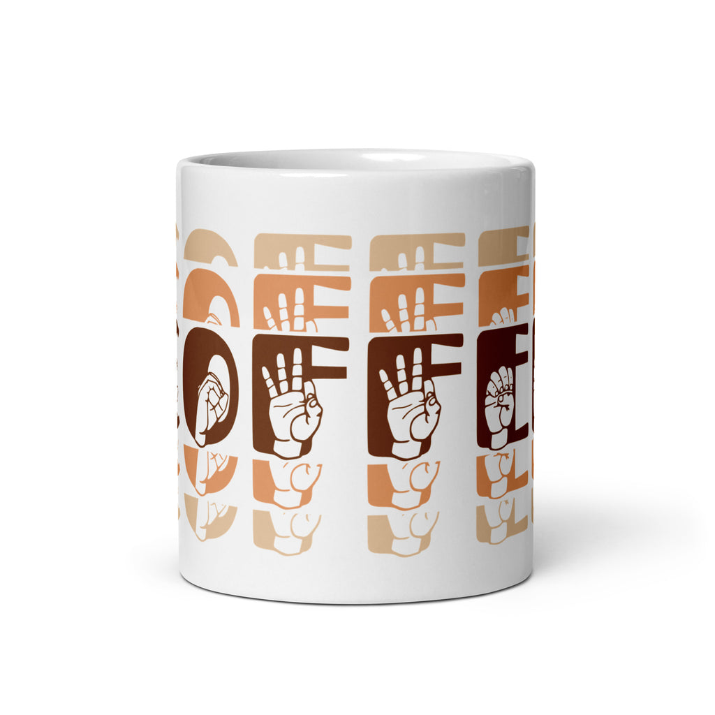 White mug with no handle visible, showing part of the phrase Coffee written in ASL Fingerspelling and Text wrapping around the mug in brown cutaway design.