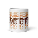 White mug with no handle visible, showing part of the phrase Coffee written in ASL Fingerspelling and Text wrapping around the mug in brown cutaway design.