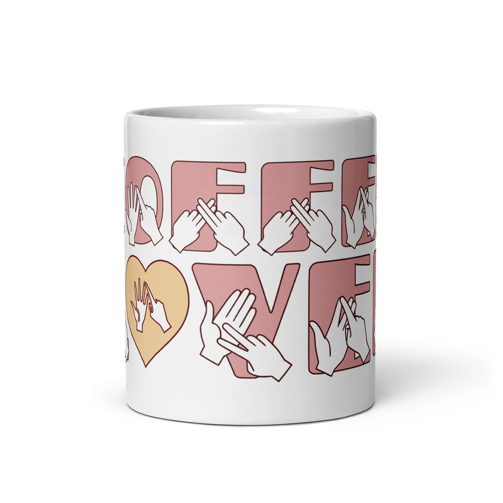 White mug featuring the phrase Coffee Lover written in BSL Fingerspelling and Text wrapping around the mug in pink.