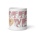 White mug featuring the phrase Coffee Lover written in BSL Fingerspelling and Text wrapping around the mug in pink.