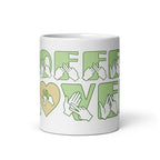 White mug featuring the phrase Coffee Lover written in BSL Fingerspelling and Text wrapping around the mug in green.