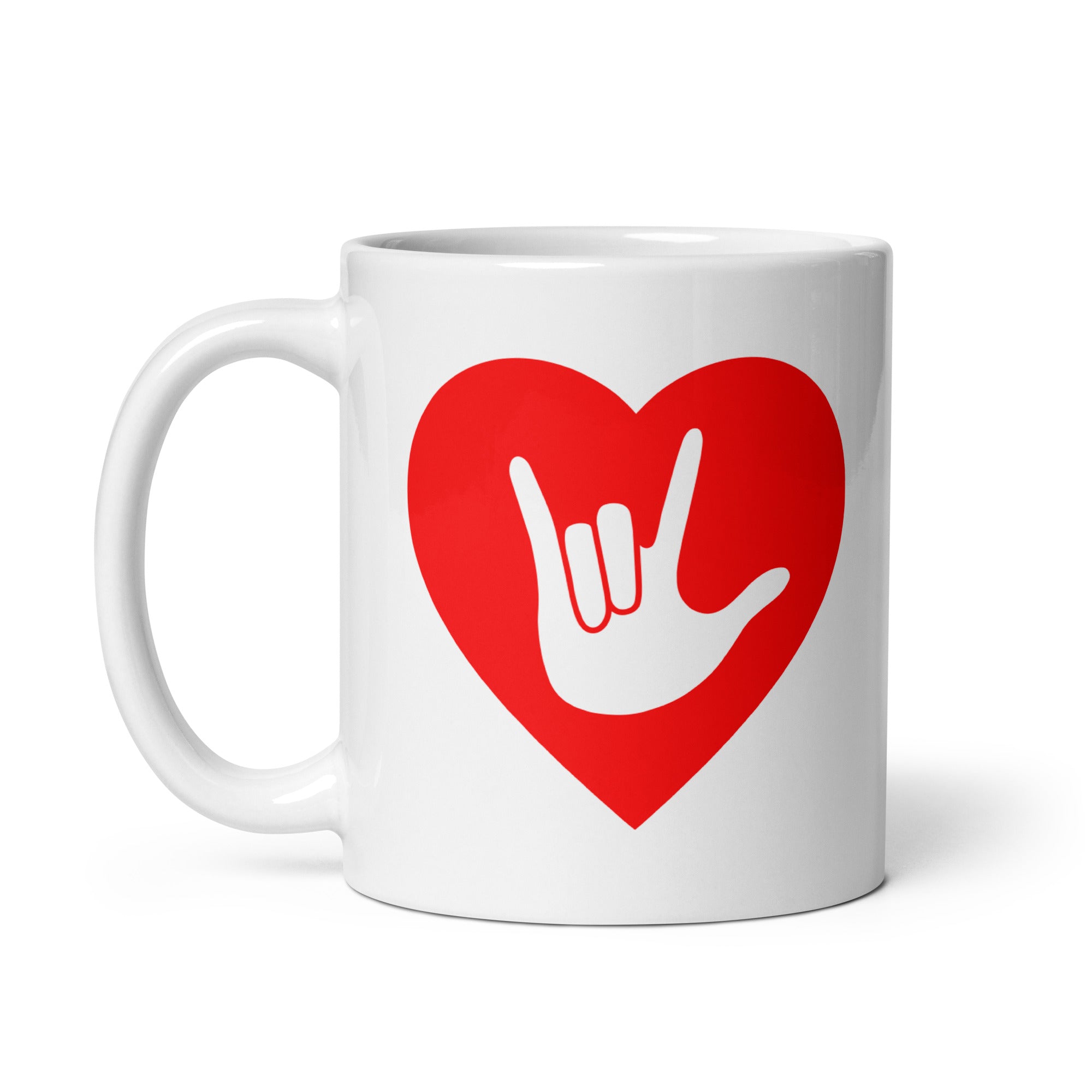 White mug with a red coloured heart design featuring the ASL sign for I Love You embedded in it. The mug handle is on the left hand side of the mug.