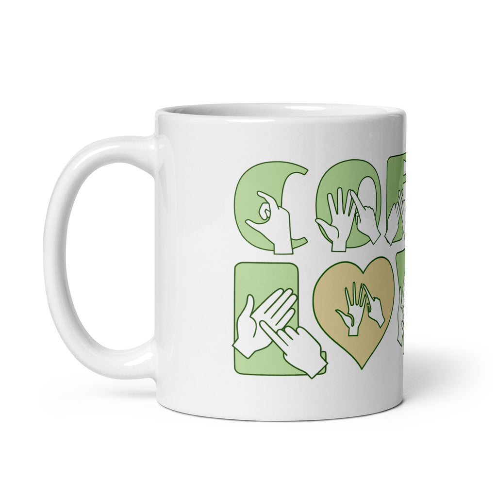 White mug featuring the phrase Coffee Lover written in BSL Fingerspelling and Text wrapping around the mug in green. The mug handle is on the left hand side of the mug.