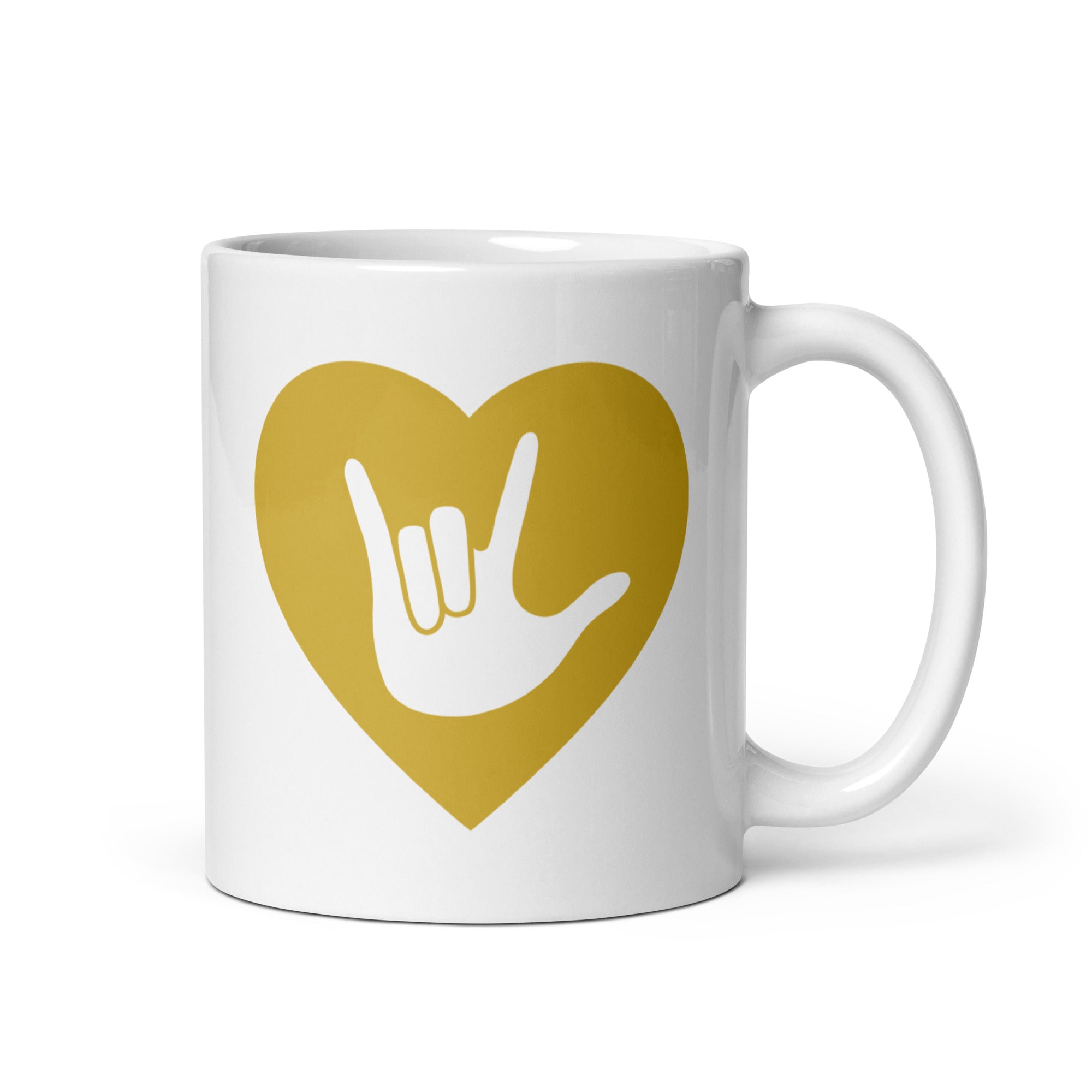 White mug with a gold coloured heart design featuring the ASL sign for I Love You embedded in it. The mug handle is on the right hand side of the mug.