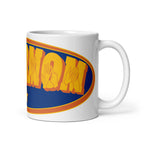 A white mug with the handle on the right showing a Supermom BSL design