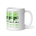 White mug featuring the phrase Coffee written in BSL Fingerspelling and Text wrapping around the mug in green cutaway design. The mug handle is on the right hand side of the mug.