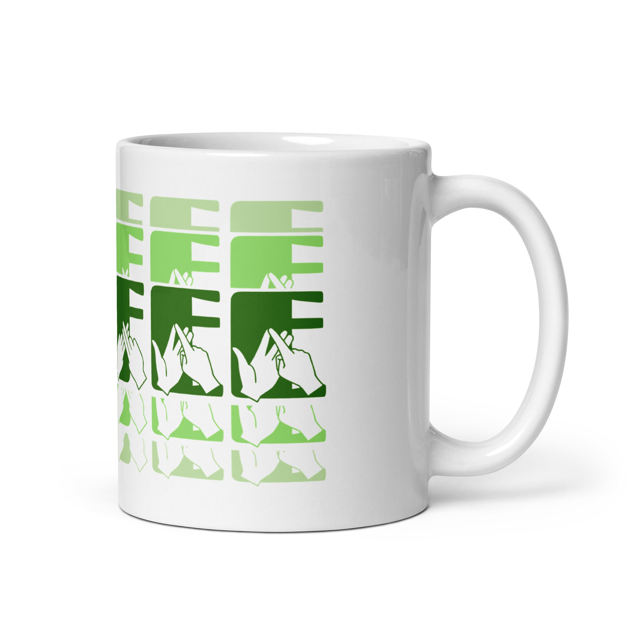 White mug featuring the phrase Coffee written in BSL Fingerspelling and Text wrapping around the mug in green cutaway design. The mug handle is on the right hand side of the mug.