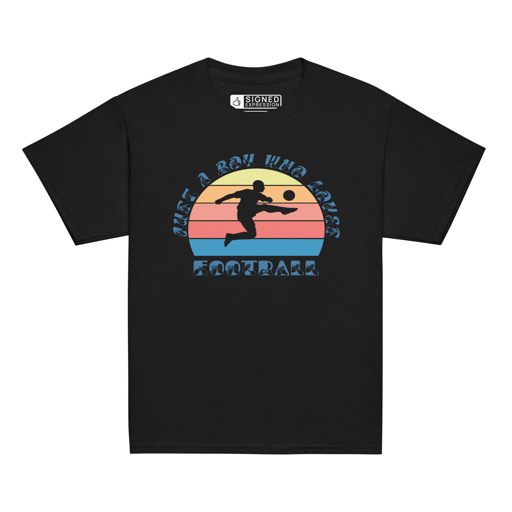 Black t-shirt with the phrase "Just a Boy Who Loves Football" in BSL Fingerspelling and text featuring a colourful retro sunset and a silhouette of a boy kicking a football.