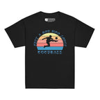 Black t-shirt with the phrase "Just a Boy Who Loves Football" in BSL Fingerspelling and text featuring a colourful retro sunset and a silhouette of a boy kicking a football.