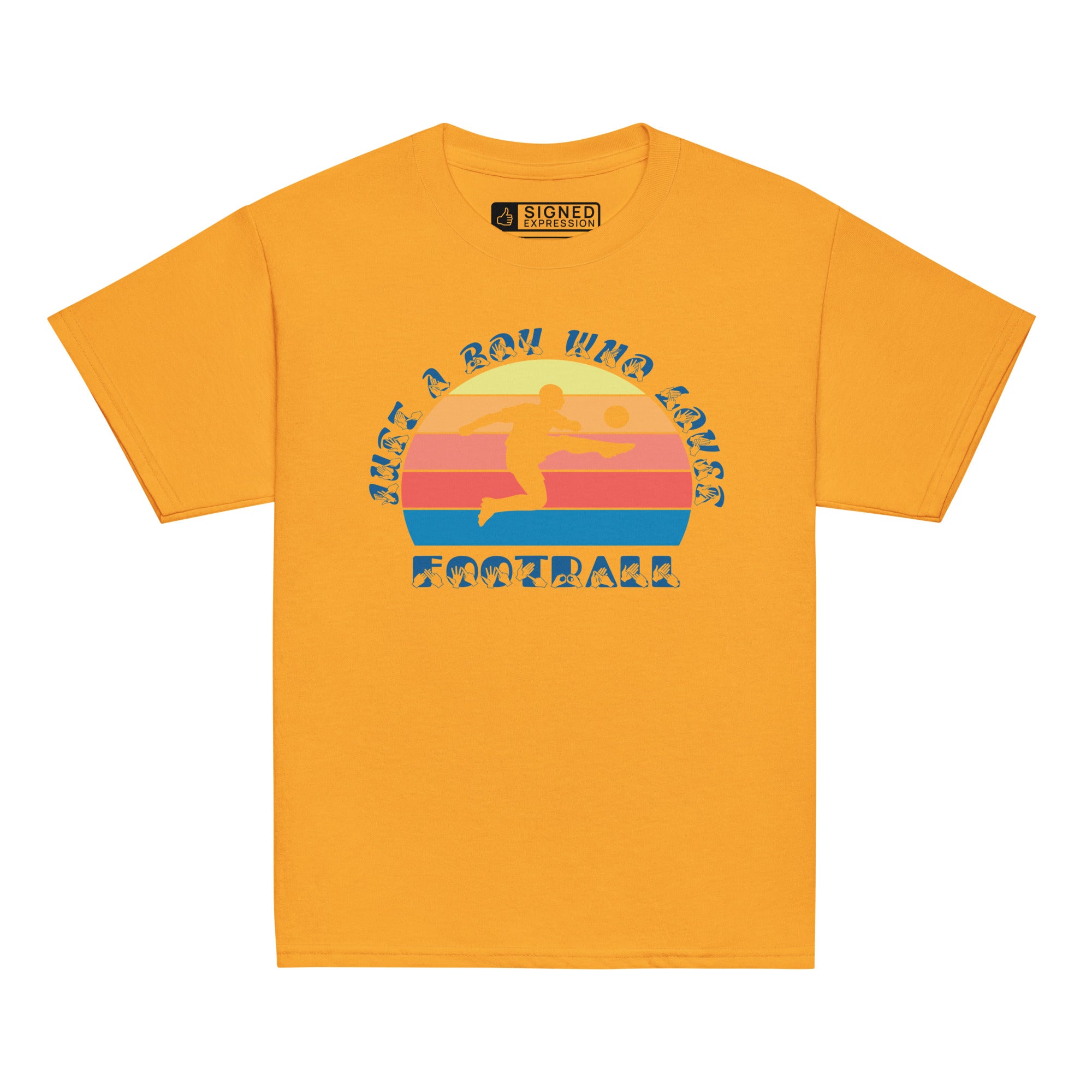 Gold t-shirt with the phrase "Just a Boy Who Loves Football" in BSL Fingerspelling and text featuring a colourful retro sunset and a silhouette of a boy kicking a football.
