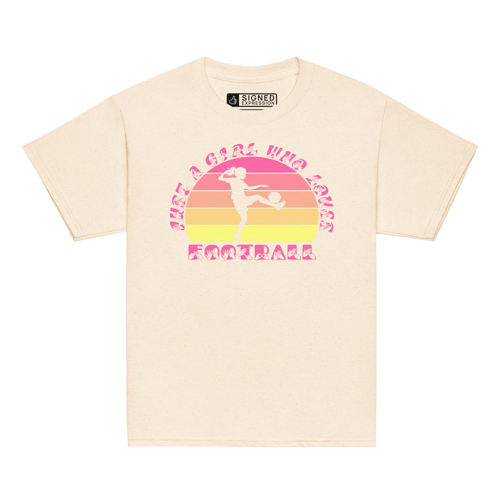 Natural t-shirt with the phrase "Just a Girl Who Loves Football" in BSL Fingerspelling and text featuring a colourful retro sunset and a silhouette of a boy kicking a football.