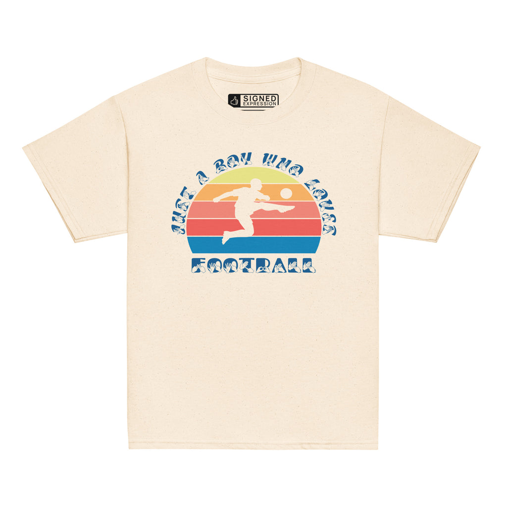 Natural t-shirt with the phrase "Just a Boy Who Loves Football" in BSL Fingerspelling and text featuring a colourful retro sunset and a silhouette of a boy kicking a football.