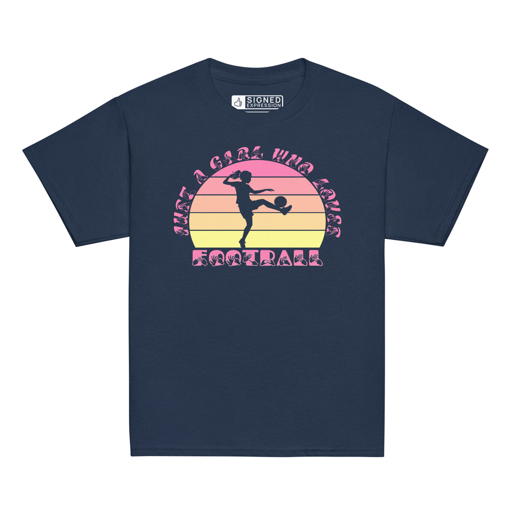 Navy t-shirt with the phrase "Just a Girl Who Loves Football" in BSL Fingerspelling and text featuring a colourful retro sunset and a silhouette of a boy kicking a football.