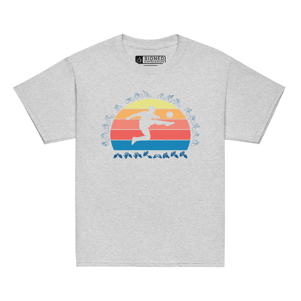 Sport grey t-shirt with the phrase "Just a Boy Who Loves Football" in BSL Fingerspelling  featuring a colourful retro sunset and a silhouette of a boy kicking a football.