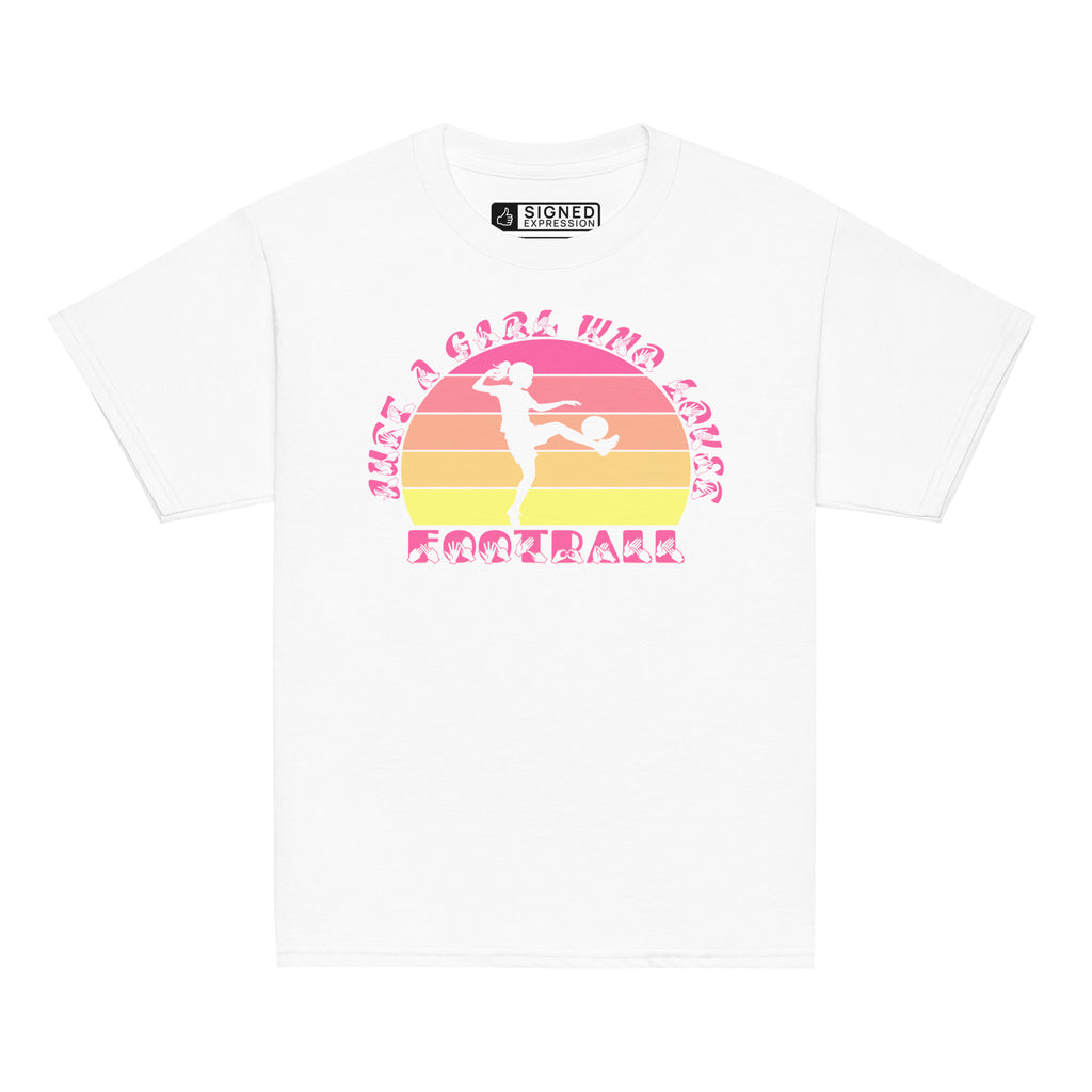 White t-shirt with the phrase "Just a Girl Who Loves Football" in BSL Fingerspelling and text featuring a colourful retro sunset and a silhouette of a boy kicking a football.